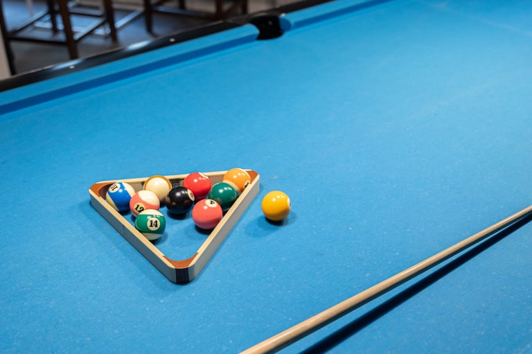 Rhythm and focus of a billiard game with blue table and colorful balls
