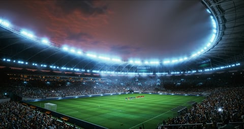 Professional stadium packed with roaring fans under floodlights for a championship event
