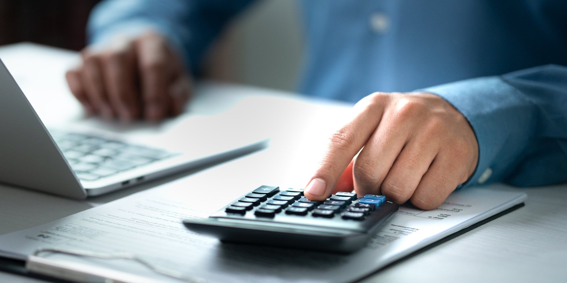 Modern financial management via laptop and digital tax analysis