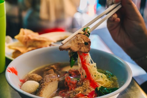 Thai noodle soup with pork and fish balls