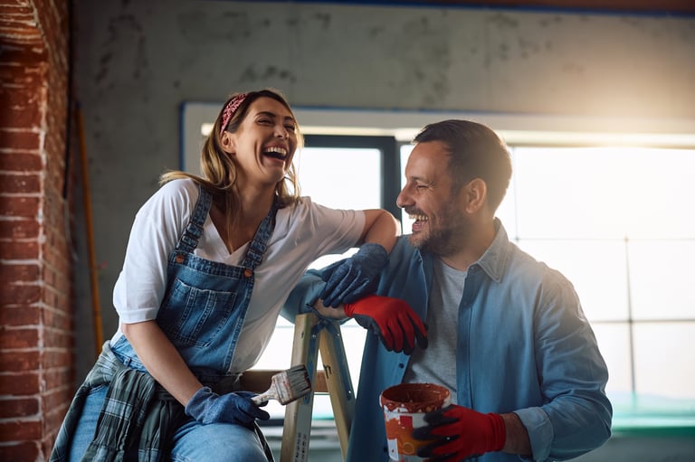Happy couple after painting project