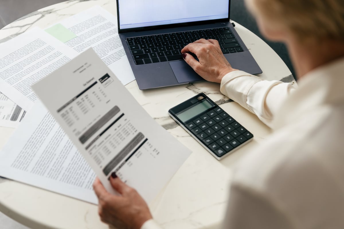 Family standing in front of their new home