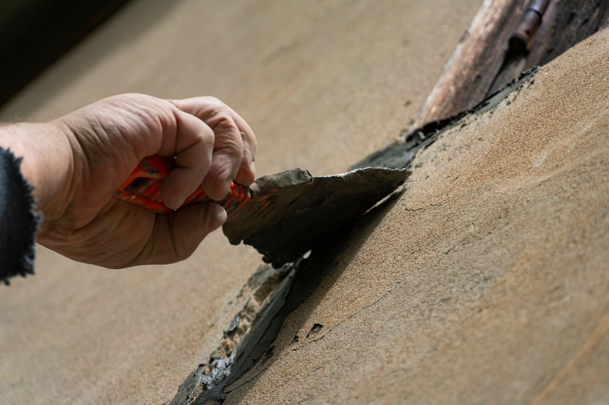 Rickett's craftsman applying concrete coating