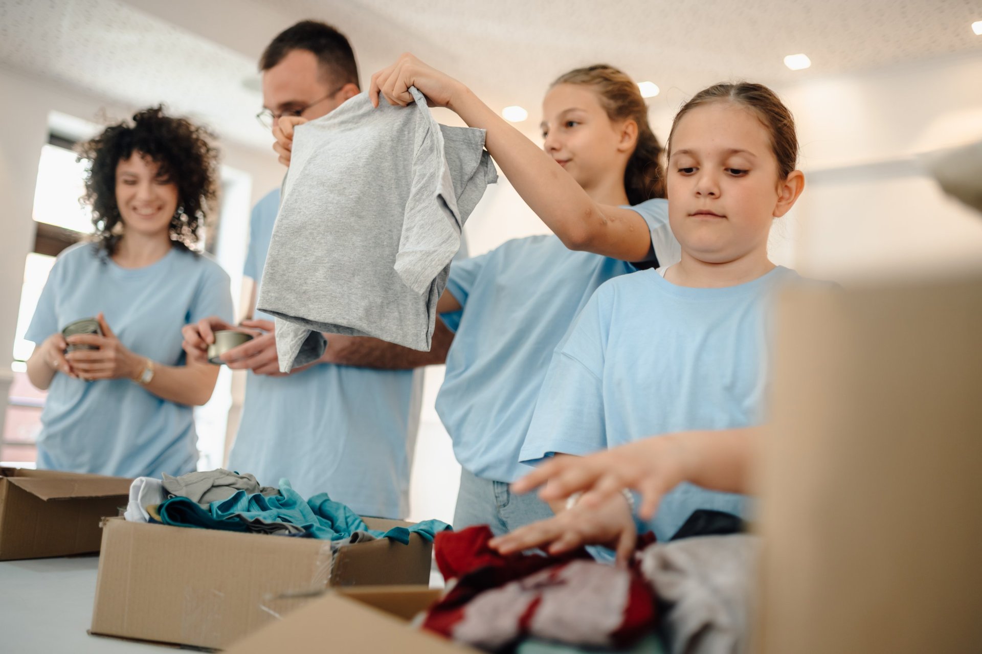 Volunteers sorting donated clothes and food