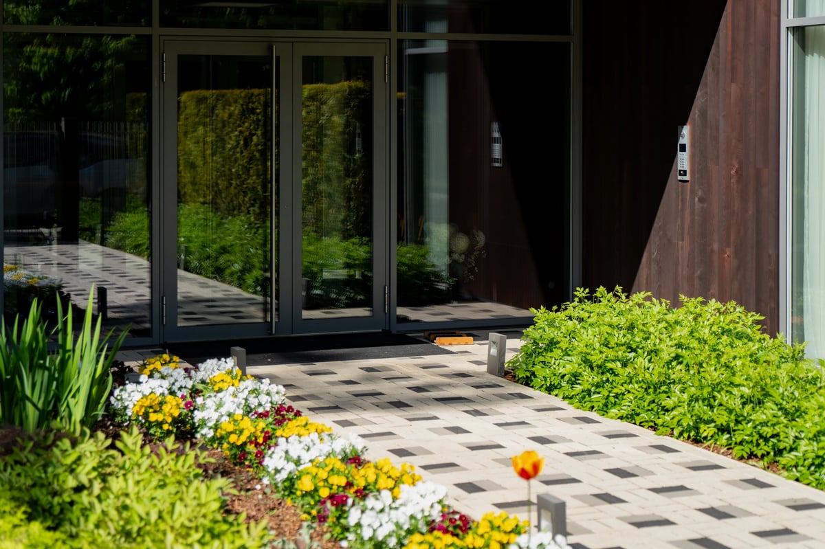 Modern California front entrance of a high-equity home