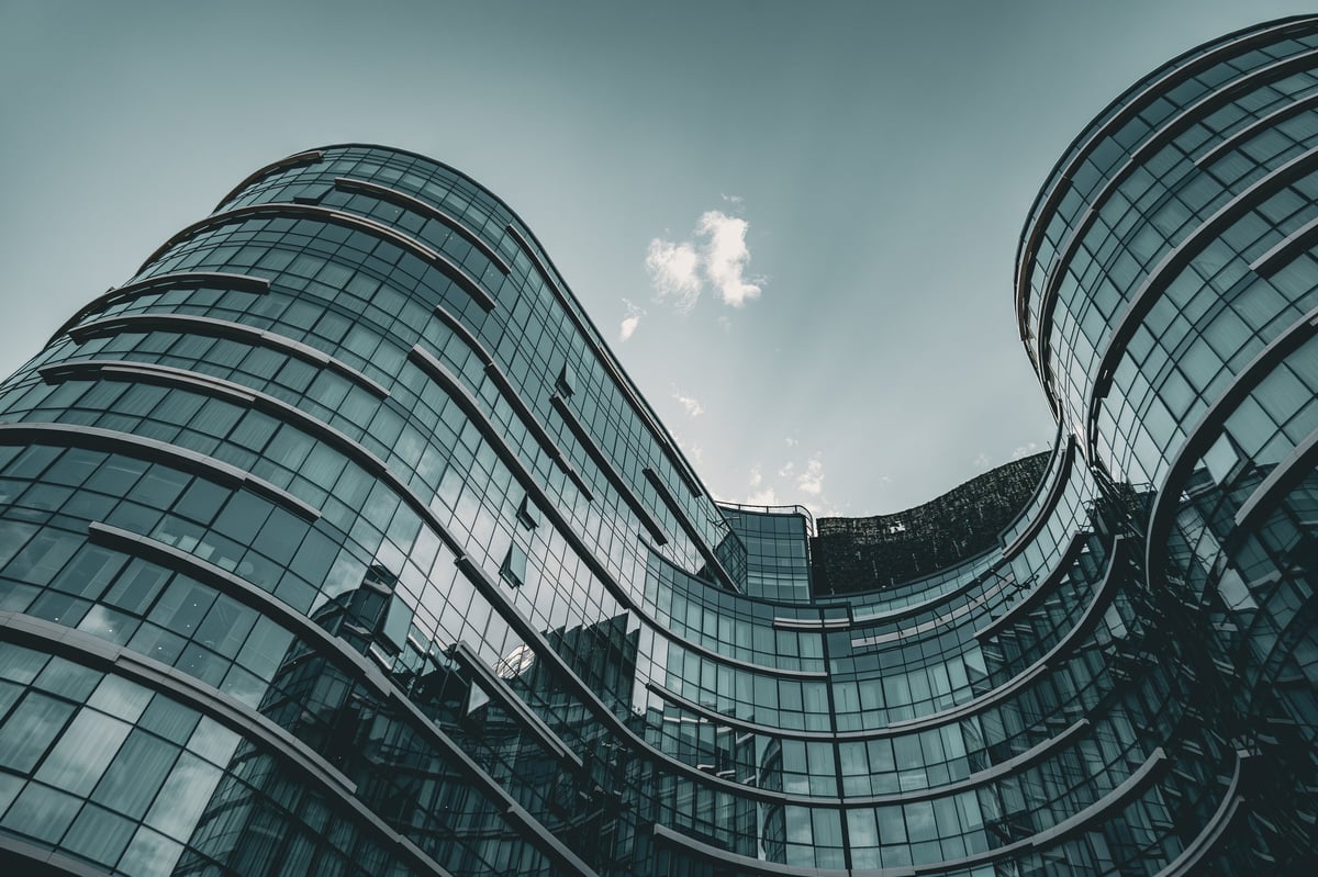 Contemporary glass office complex with sweeping curved facades