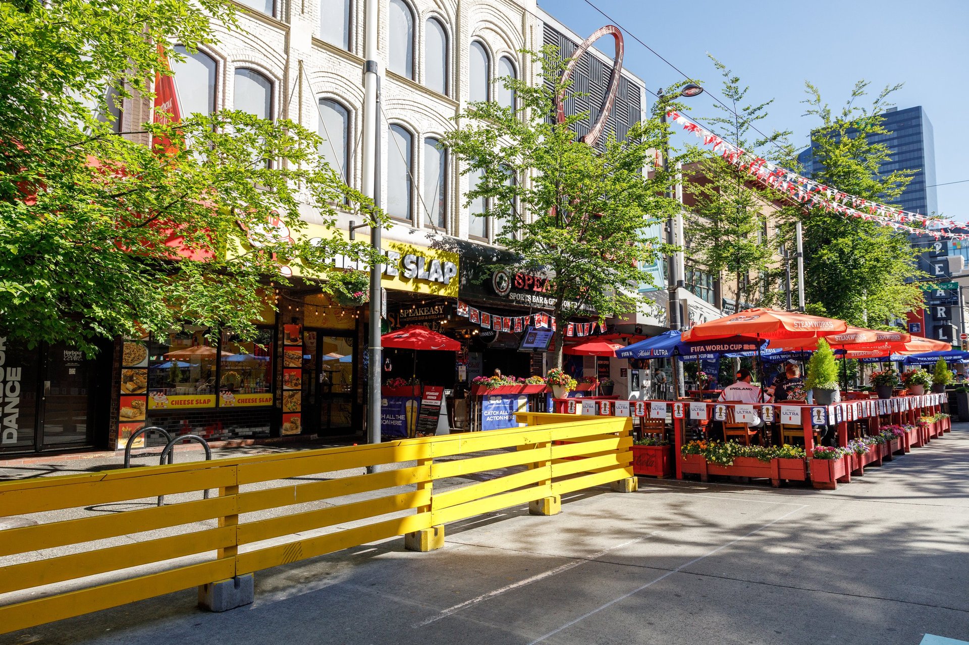 Busy restaurant patios on a pedestrian street in Vancouver, the kind of business CBB Group finances