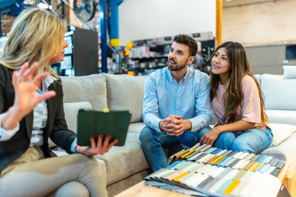 Couple reviewing financing options with a sales consultant