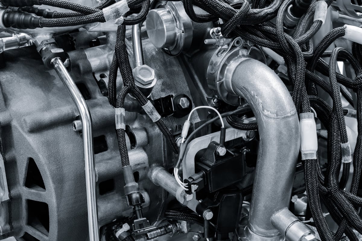 Close-up Open for service aircraft engine with many tubes of wires for valve switches and automation