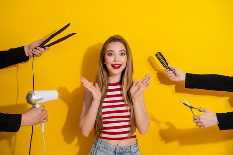 Young woman with long blonde hair reacting with delight