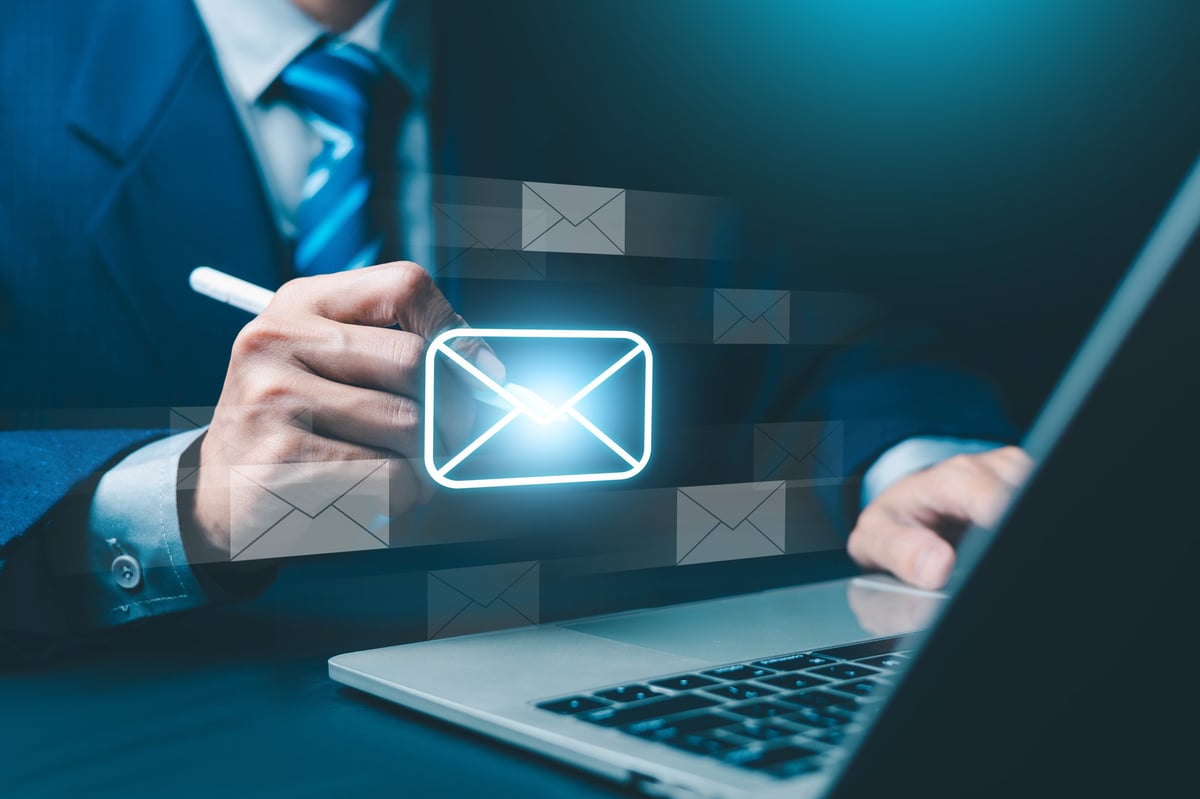 Business professional setting up email and digital communication systems for their company