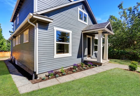 American house exterior with clean blue siding