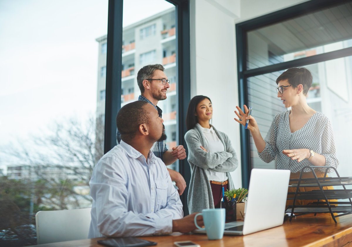 Colleagues having a discussion in a modern office