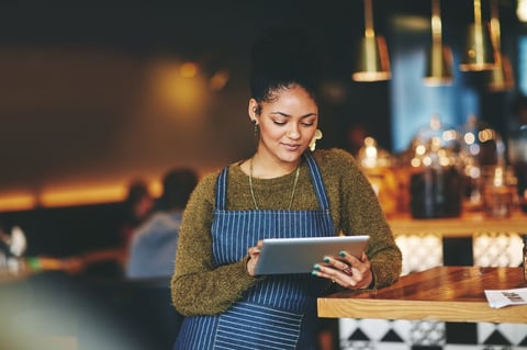 Professional using a digital tablet with a modern website