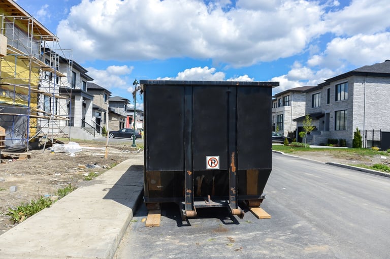 Loaded dumpster near construction site in Montreal