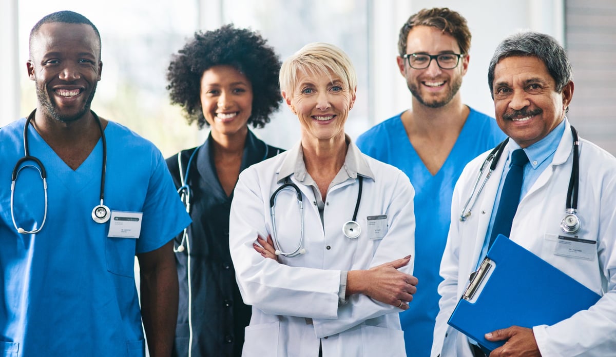 Portrait of a diverse team of doctors standing together in a hospital