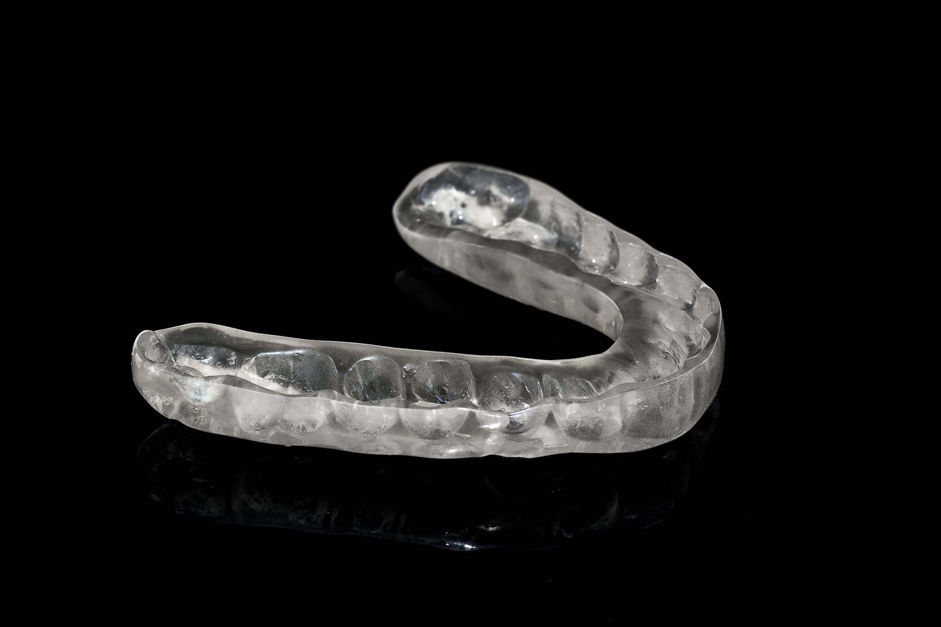 Clear custom dental nightguard used to treat and prevent teeth grinding (bruxism)