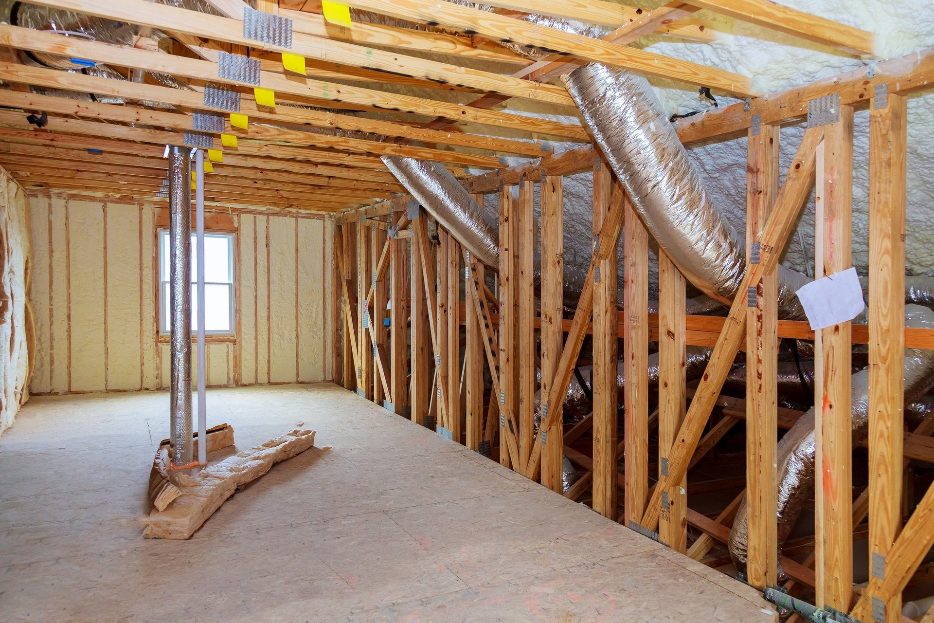 Attic loft insulation with mineral wool and wood in prefabricated house