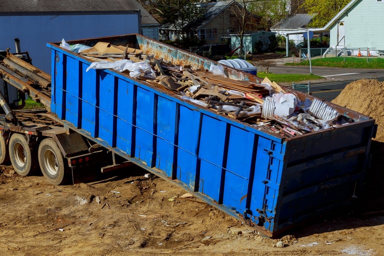 Truck loading a recycling container