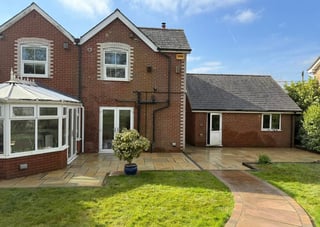 Sandstone patio with conservatory