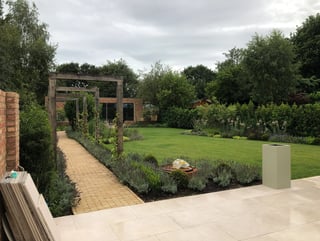 Garden with pergola and lawn