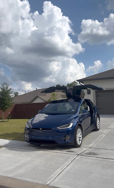KJAJ Details finished detail — deep blue Tesla Model X with falcon wing doors open