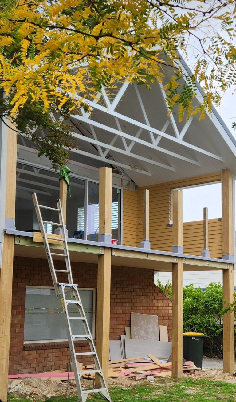 Modern home renovation with timber extension and deck, rebuilt by AGJ Construction on Auckland's North Shore