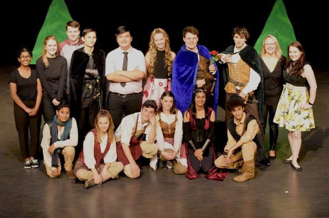 Young performers celebrating on theater stage