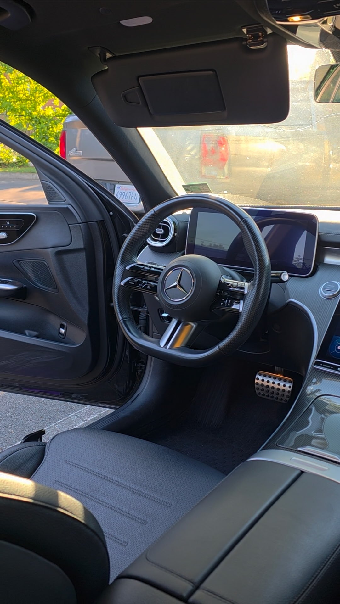 Mercedes-Benz interior detail with open driver door