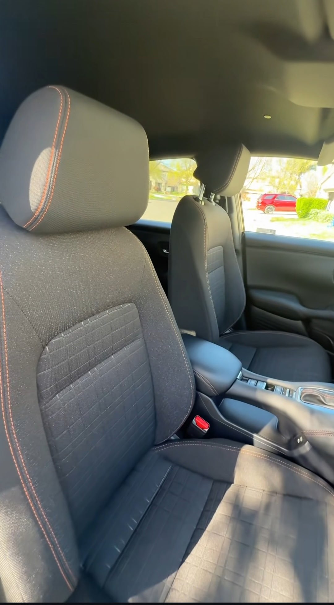 Gray fabric seats with red contrast stitching — back seat view