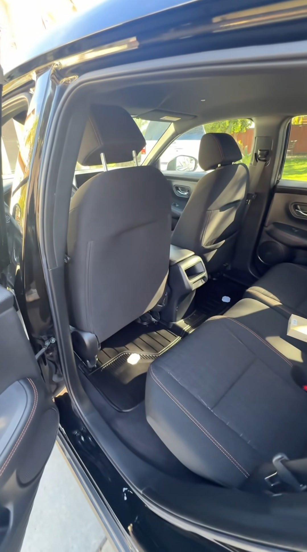 Compact car with black and tan leather seat interior detail