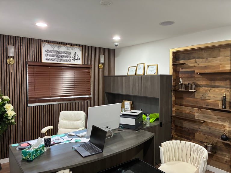 Director's office with warm wood shelving, modern desk, and Islamic calligraphy honoring the community we serve