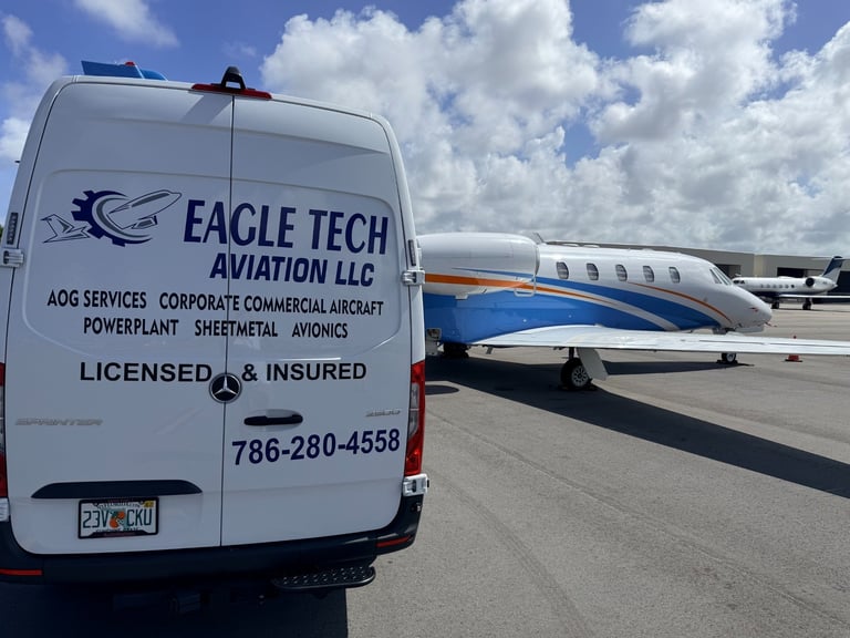 Eagle Tech Aviation LLC service van parked on tarmac beside corporate aircraft