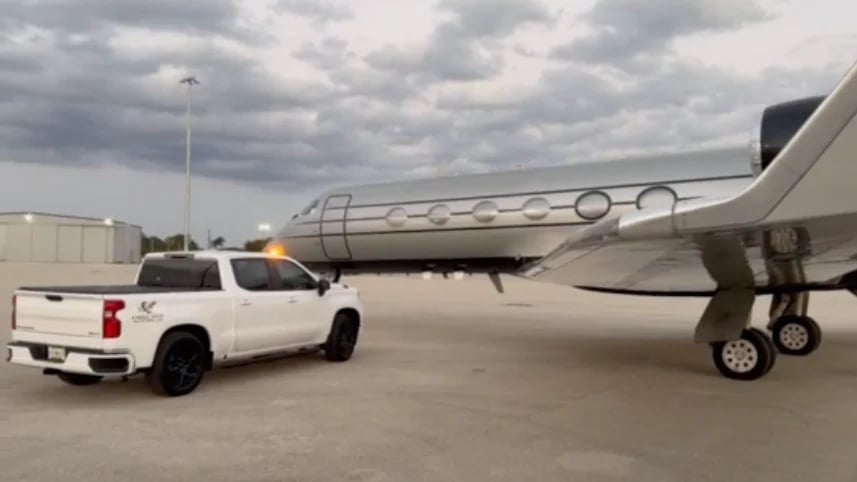 Eagle Tech Aviation service vehicle parked beside a private jet with stairs extended on a tarmac — mobile AOG response