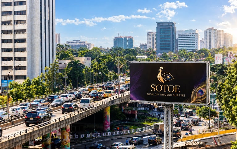 Urban highway with heavy traffic and SOTOE billboard, city skyline with office buildings and palm trees in background