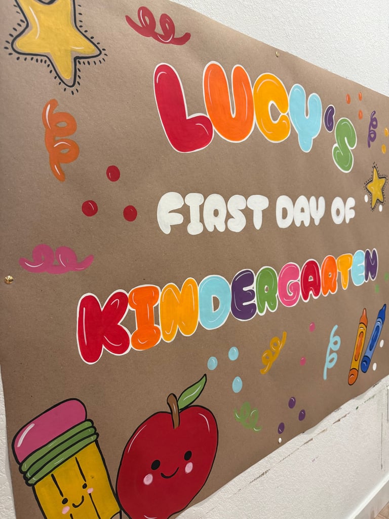 Colorful poster with Lucky First Day of Kindergarten text decorated with stars, pencils, and smiling apple illustration