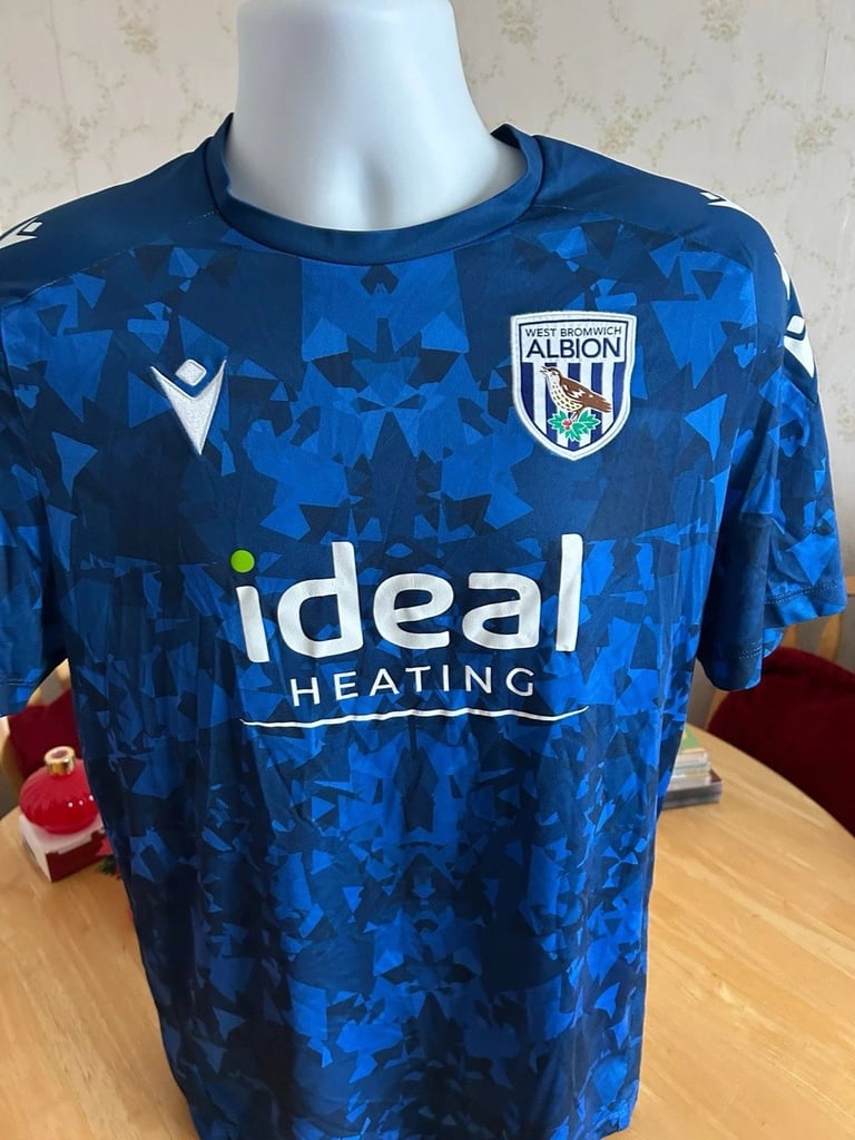 West Bromwich Albion pre-match training shirt on a mannequin