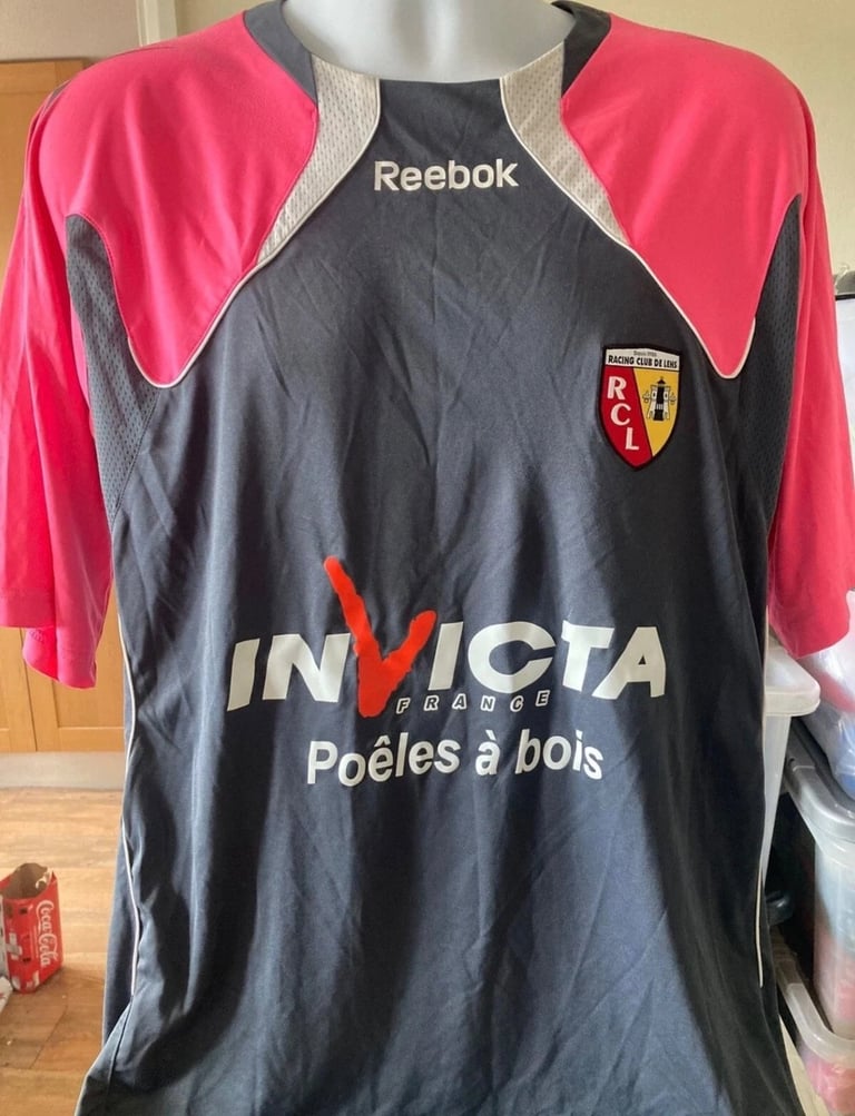 RC Lens away football shirt 2010/11 on a mannequin