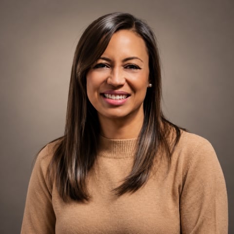 Wanessa Pizaia, financial manager at Duomo Group, smiling in a tan sweater against a neutral backdrop