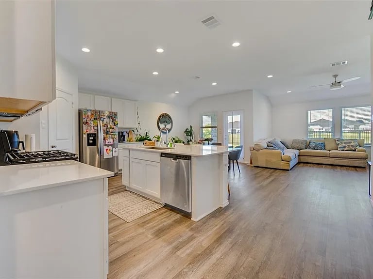 White Kitchen Island with Backyard View