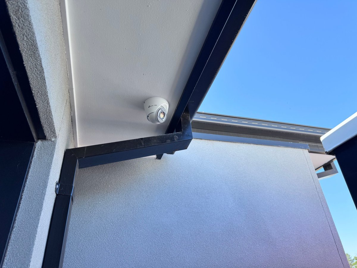 Security access control door with keyed lock mechanism installed at a Melbourne property, part of an integrated security system