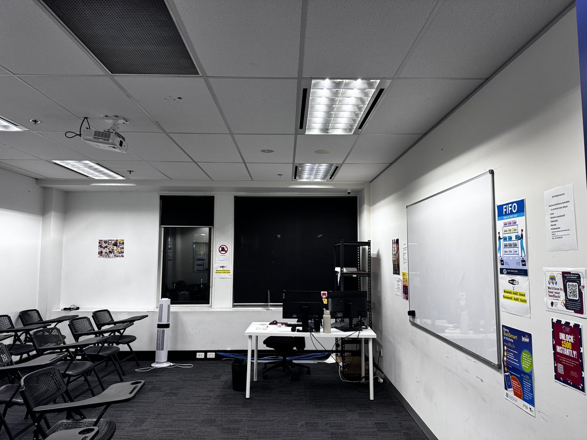 Commercial AV and structured cabling installation in a Melbourne office meeting room with wall-mounted displays and network connectivity