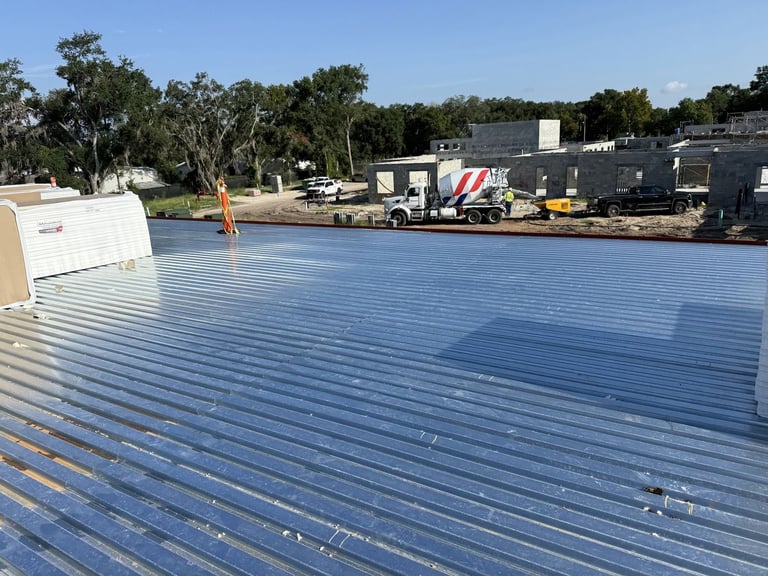 Galvanized steel roof deck ready for insulation on a new commercial building in Leesburg, FL