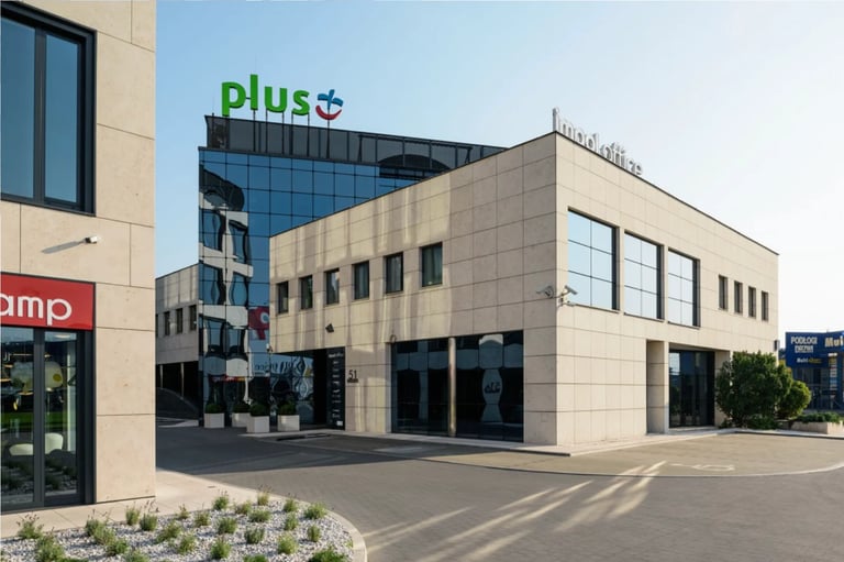 Modern commercial building with plus logo on rooftop, beige facade, and street-level storefront entrance