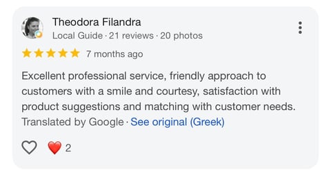 Five-star review from Theodora Filandra, a local guide, praising professional service and friendly customer approach