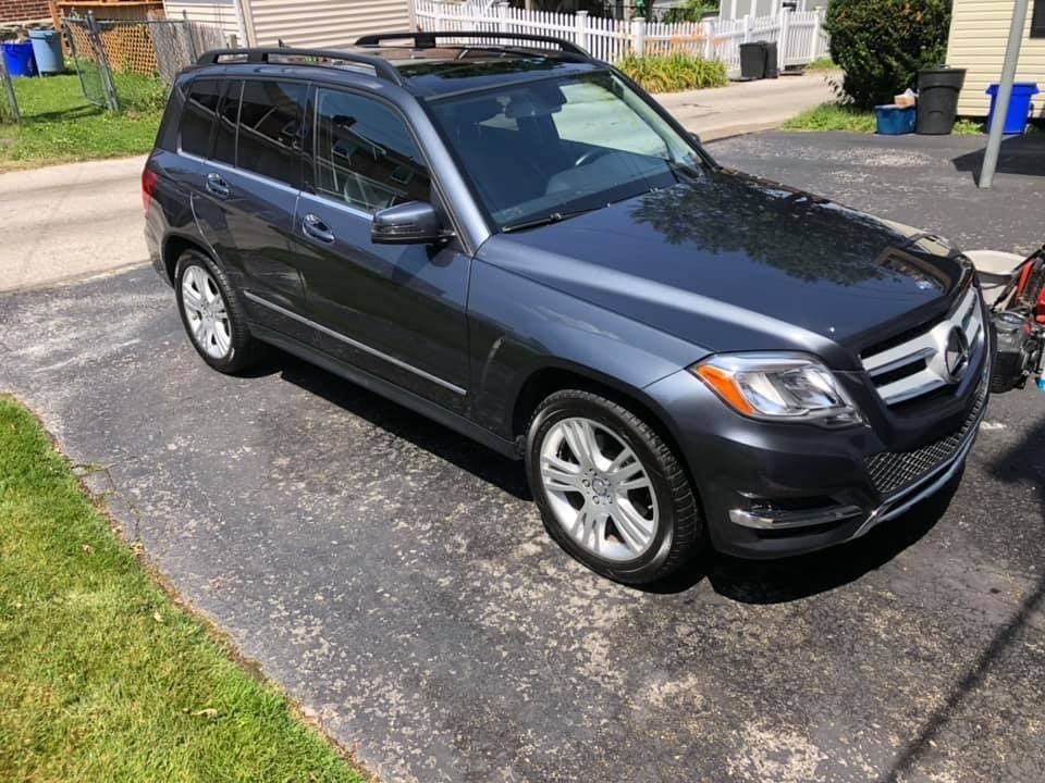 Gray Mercedes-Benz GLK-Class SUV detailed and parked in a residential driveway