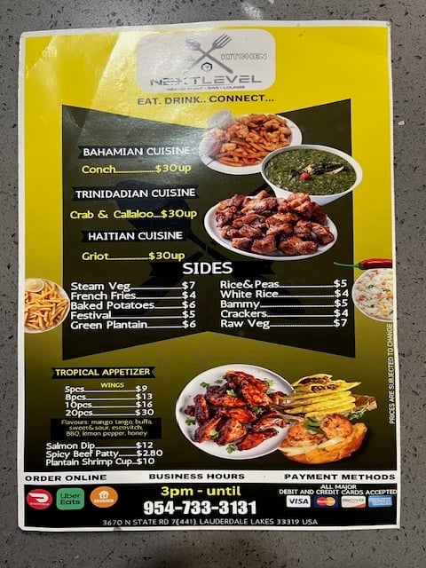 Yellow restaurant menu for Next Level Caribbean cuisine featuring Bahamian, Trinidadian, and Haitian dishes with prices and contact information