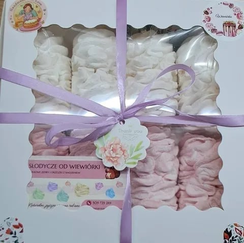 Gift box of white and pink handmade soaps tied with purple ribbon and thank you tag