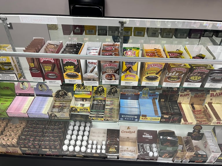 Display case filled with various chocolate bars, candies, and confectionery products arranged on multiple shelves
