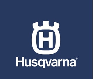 Husqvarna logo featuring a white H within a shield emblem on a dark blue background